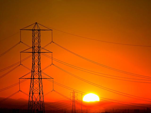 Sunset behind powerlines